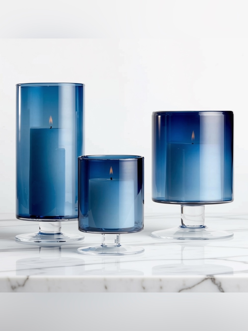 Crate & Barrel Blue Glass Pedestal Hurricane Set